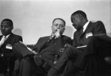 Congressman Carl Elliott seated with two other men during a meeting of educators at Alabama State College in Montgomery, Alabama.