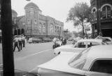 Police officers in the street outside 16th Street Baptist Church in Birmingham, Alabama, after the building was bombed.