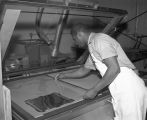 Employee working at the Paragon Press at 4760 Selma Highway in Montgomery, Alabama.