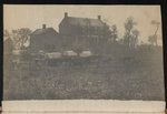 [Horses and covered wagons in front of two-chimney brick house and outbuildings, probably at Camp Griffin, Langley, Virginia]