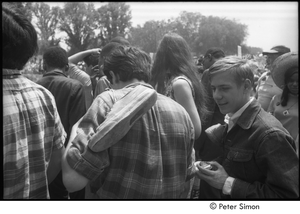 Protestors carrying shoes after wading in the Mall reflecting pools during the Poor People's Campaign Solidarity Day