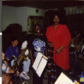 Series of two Polaroid photographs of Marzette Lewis with the Charles I. West Middle School Band