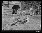 [Untitled photo, possibly related to: Negro helper with wagon in front of J.V. Harris' barn, nine miles south of Chapel Hill on Highway 15. Chatham County, North Carolina]