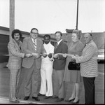 American Storage ribbon-cutting participants posing together, Los Angeles