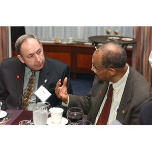 Two men speak together at The National Council Dinner