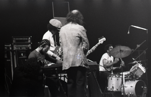 Miles Davis in performance: Cedric Lawson (keyboard), Reggie Lucas (guitar), Dave Liebman (back to camera), Al Foster (drums)