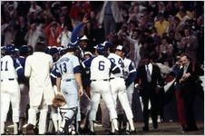 Hank Aaron being congratulated at home plate after breaking the home run record, 1974