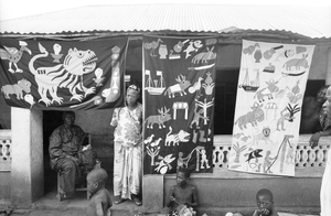 Appliqué workers, in street, Abomey, Benin