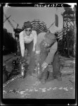 Baltimore, Maryland. Building the SS Frederick Douglass. More than 6,000 Negro shipyard workers are employed at the Bethlehem-Fairfield shipyards, where the Liberty ship is being rushed to completion. The noted orator and abolitionist leader worked as a ship caulker in the vicinity of this yard before he escaped from slavery. Riveters Dave Martin and Walter Shired pose for cameraman