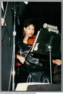 Photograph of a young girl playing her instrument