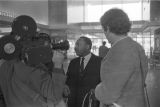 Martin Luther King, Jr., being interviewed at the airport in Montgomery, Alabama.