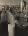 Dr. George Washington Carver in his laboratory on the campus of Tuskegee Institute.