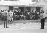 Thumbnail for Edward Rudolph and others, standing on the porch of the Autauga County Improvement Association office in Prattville, Alabama, on the day of a civil rights march.