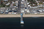 An October 2017 aerial view of Old Orchard Beach and its amusement park and lengthy pier on the southern Maine coast along the Atlantic Ocean