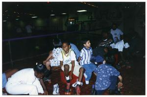 Boys and Girls Putting on Roller Skates