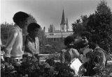 Marquette students converse in the gardens outside the Joan of Arc Chapel, circa 1975