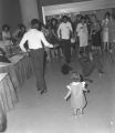 Young men breakdancing during the Chamber of Commerce trade show at Garrett Coliseum in Montgomery, Alabama.