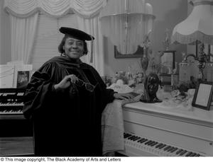 Photograph of Francine Morrison posing with her awards