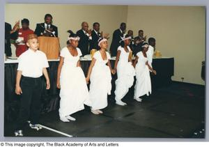 Photograph of youths dancing together