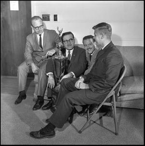 Leon Breeden sitting with jazz trophy