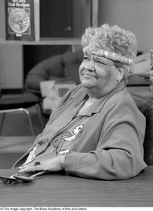 Photograph of Clara Miles with her serving spoons