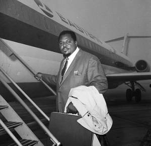 Noble Beasley boarding a plane at the municipal airport in Mobile, Alabama.