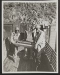 Shells for the Battle of Brest are unloaded from a freight car on a rail siding by Pfc. Robert L. Lewis, left, of Murfreesboro, Tenn. and Pvt. Mercie Gillmore, right of Holly Hill, S.C.