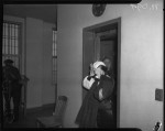 Ann Forst walks into county jail after being charged for operating a prostitution ring, Los Angeles, 1940