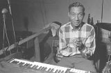 Willie Green seated at a keyboard at Tom's Place at 648 South Holt Street in Montgomery, Alabama.