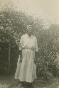 Gullah woman standing by trees