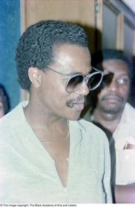 Photograph of a man wearing sunglasses