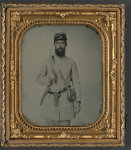 [Corporal John Agee Booker of Co. D, 21st Virginia Infantry Regiment, in uniform with Bowie knife, flintlock pistol, and tin drum canteen with his name on it]