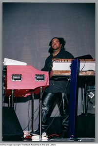 Medium shot of keyboard player Bobby Sparks onstage