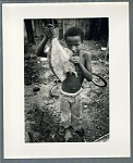 Young boy holding filleted fish