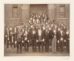 [African American men posed at entrance to building, some with derbys and top hats, and banner labeled "Waiters Union" in Georgia]