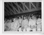 Crowd watching USO show "Hellzapoppin" from bleachers