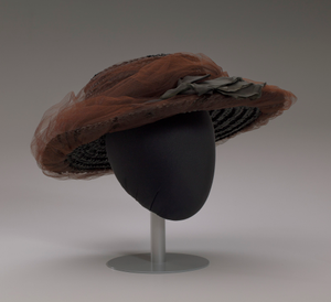 Black raffia hat with brown and black decorations from Mae's Millinery Shop