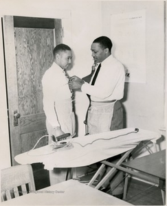 Student Measuring a Classmate in Sewing Class, Storer College, Harpers Ferry, W. Va.