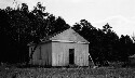 Old one room school (white) near Raxburg. Replaced by new building