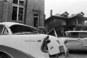 Damaged cars in the street outside of 16th Street Baptist Church in Birmingham, Alabama, after the building was bombed.