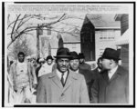 [Rev. Fred Shuttlesworth, accompanied by Martin Luther King and Ralph Abernathy, leads a march for voter registration in Selma, Alabama]