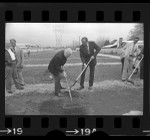 Mayor Tom Bradley and actor Eddie Albert tilling soil at dedication of community garden in Reseda, Calif., 1975