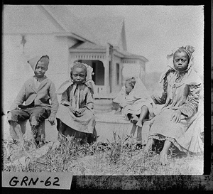 Photograph of four African-American children, Siloam, Greene County, 1900 May 28