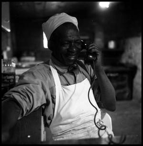 Oliver Jacobs Smiling with a Telephone