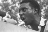 Stokely Carmichael addressing a crowd in front of the state capitol in Jackson, Mississippi, at the end of the "March Against Fear" begun by James Meredith.