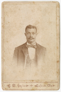 Photograph of a man in a suit, vest and necktie