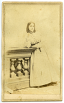 Portrait of unidentified girl leaning on balustrade