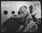 Production. BT-13A ("Valiant") basic trainers. Negro aircraft worker at Vultee's Downey, California plant. At the Downey plant is made the BT-13A ("Valiant") basic trainer--a fast, sturdy ship powered by a Pratt and Whitney Wasp engine