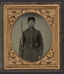 [Unidentified young soldier in Union uniform with revolver, musket, and attached U.S. model 1862 Zouave sword bayonet]