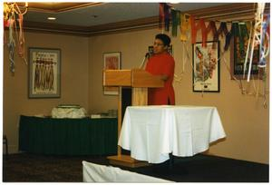 Woman in Red Delivering Speech at Service to Youth Award Program